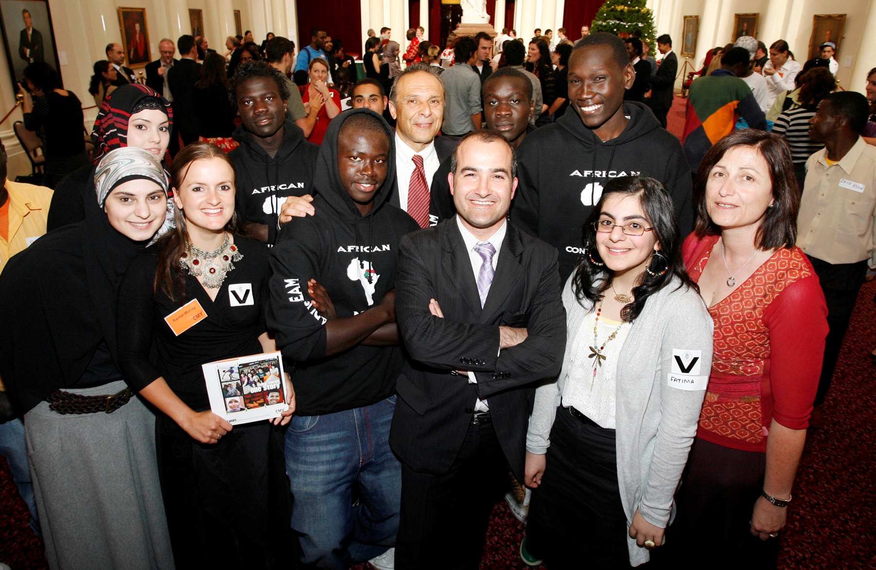 Carmel Guerra, Minister James Merlino, Hass Dellal and young people at the launch of the CMY 20th Anniversary event